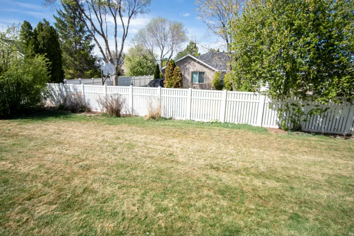 View of fenced backyard