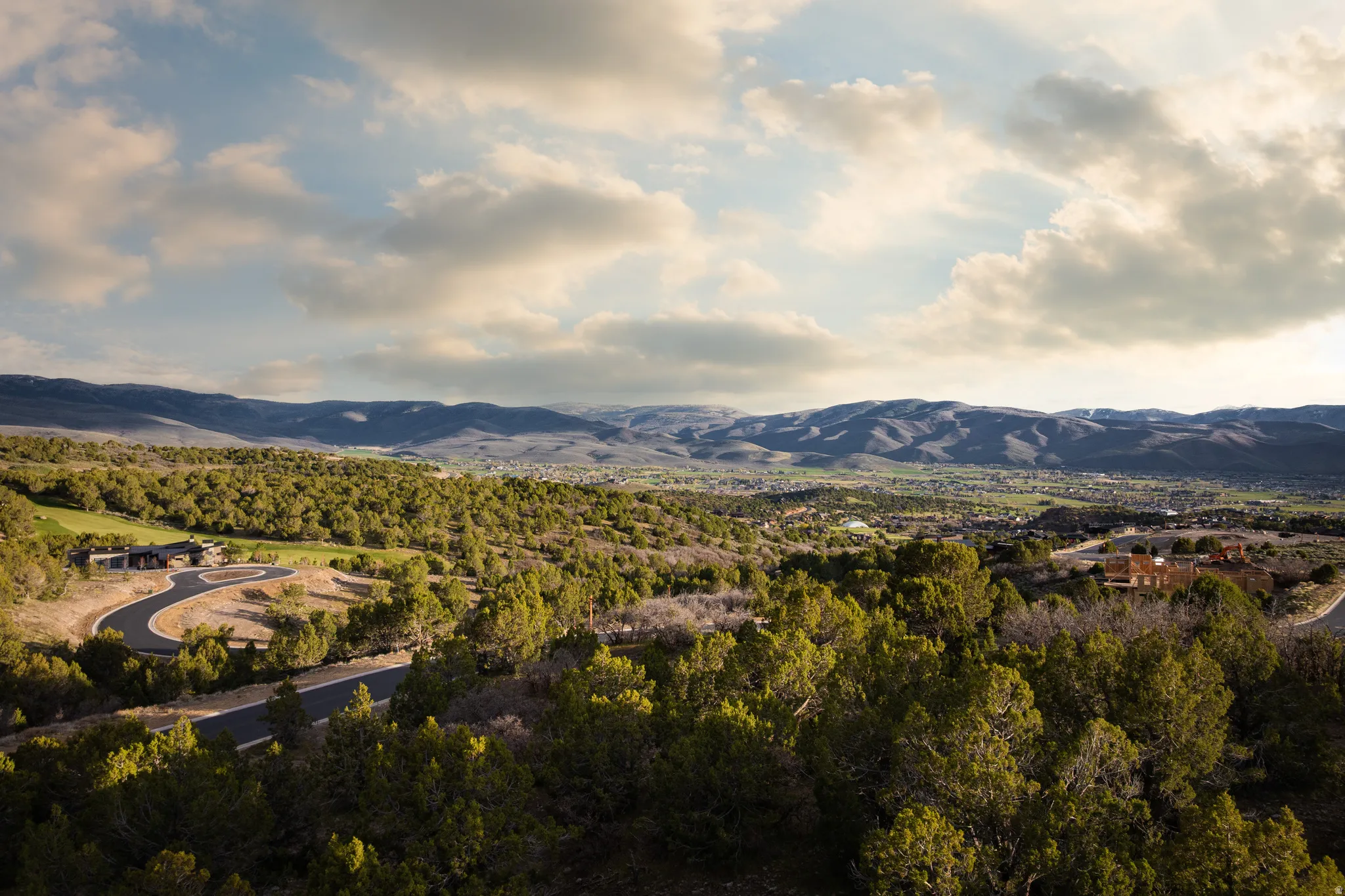 View of mountain background featuring a heavily wooded area