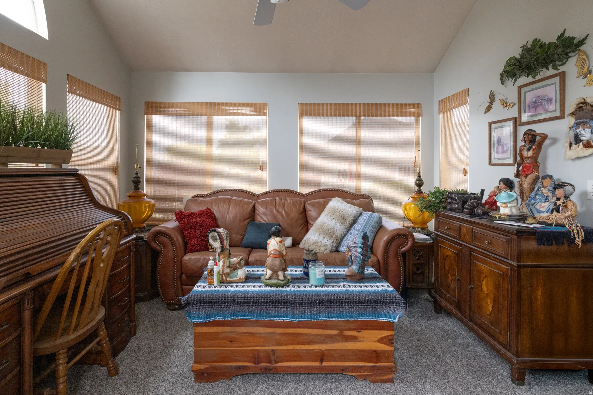 Bonus room , could be another bed room attached to living room with french doors. Carpeted living area with a ceiling fan and vaulted ceiling.  Has separate walk out entrance.