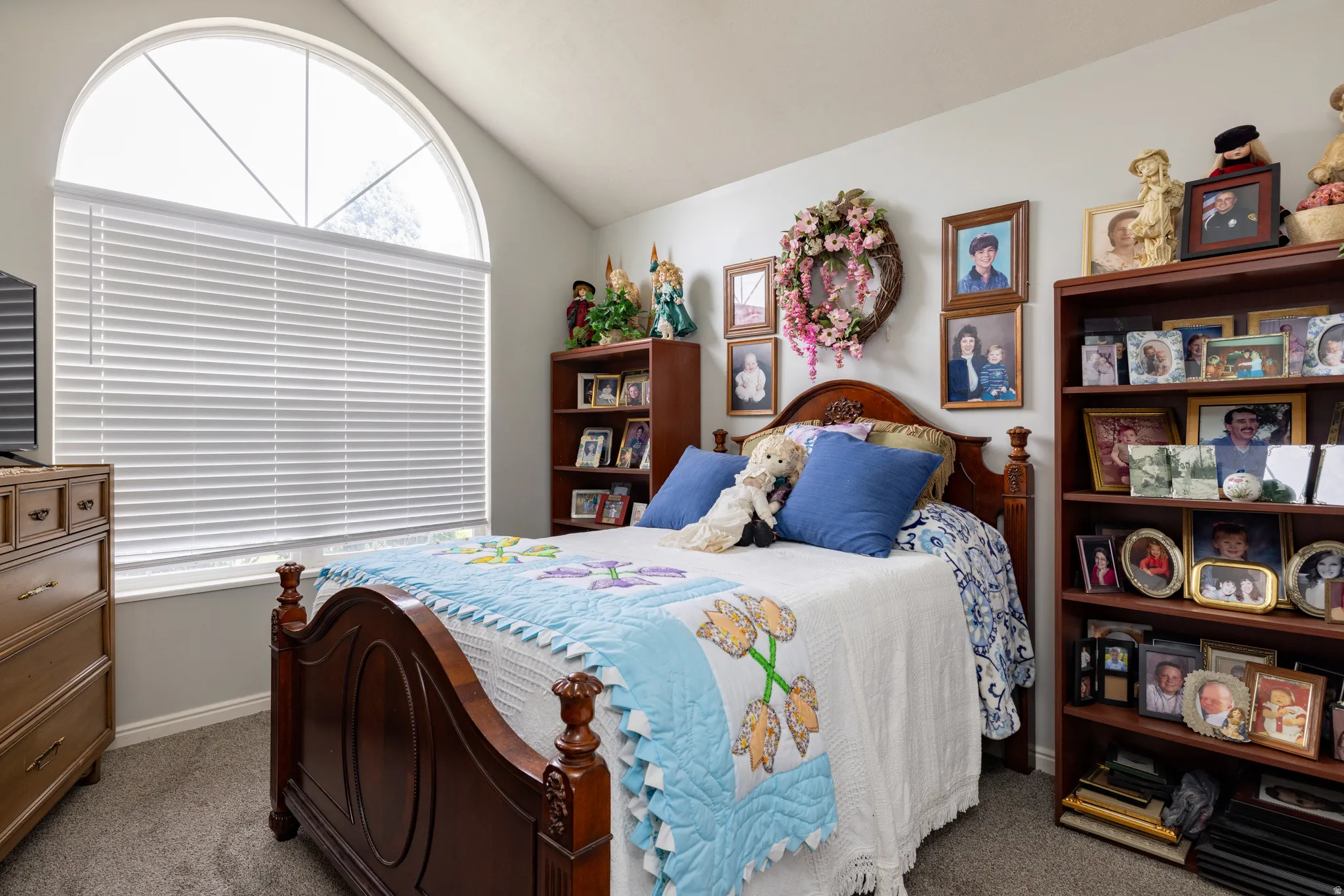 Bedroom 3 with carpet flooring and lofted ceiling
