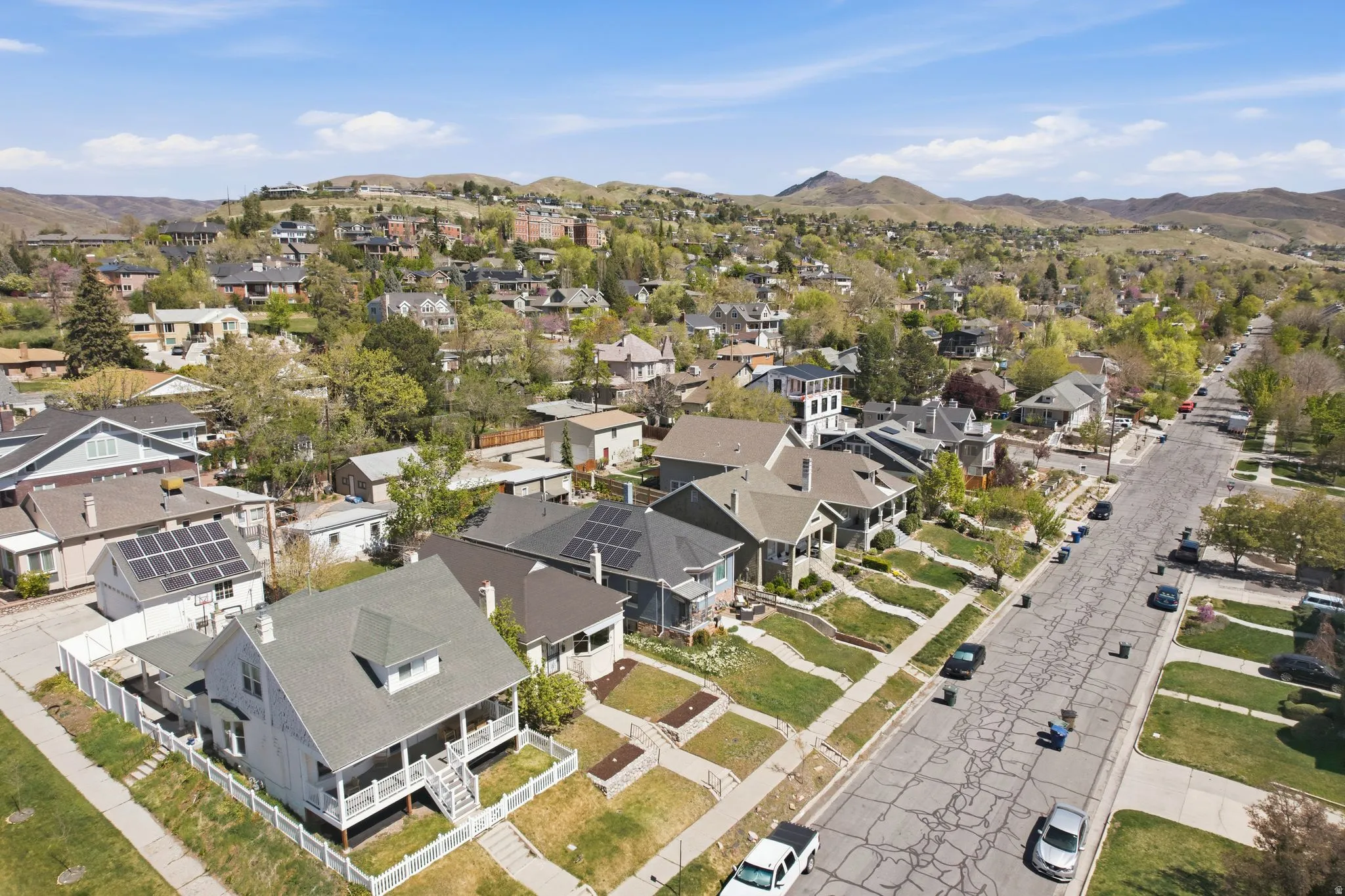 Aerial view of residential area featuring a mountainous background