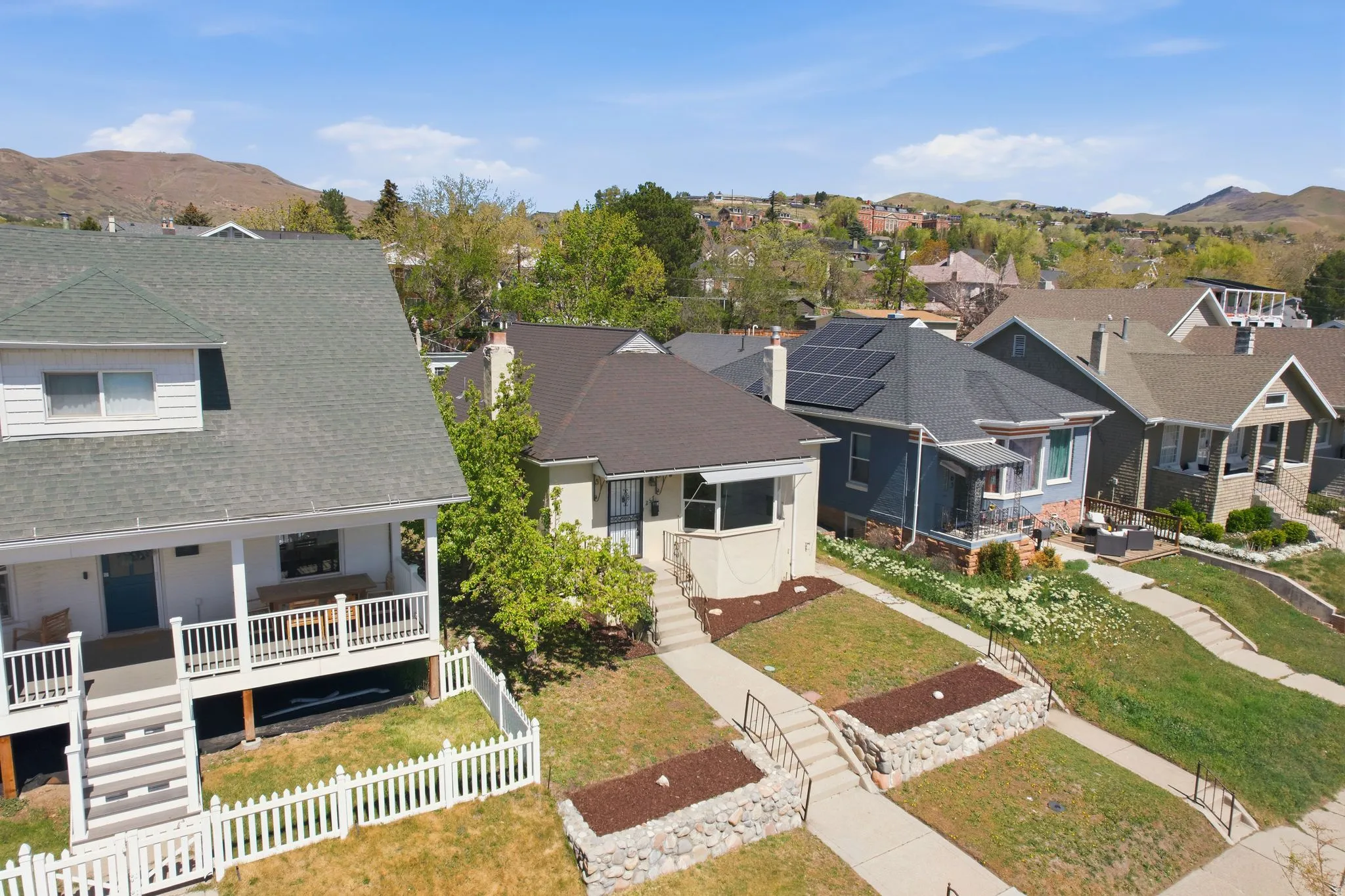 Aerial perspective of suburban area with a mountain backdrop