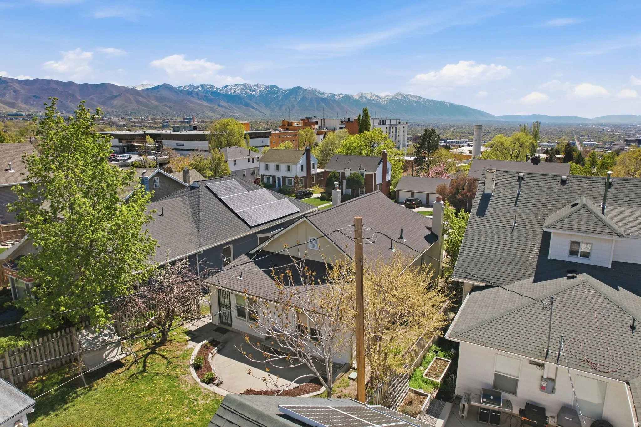 Aerial view of residential area featuring a mountain backdrop