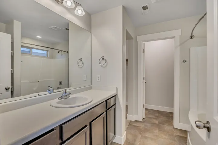 Full bath featuring vanity and tub / shower combination