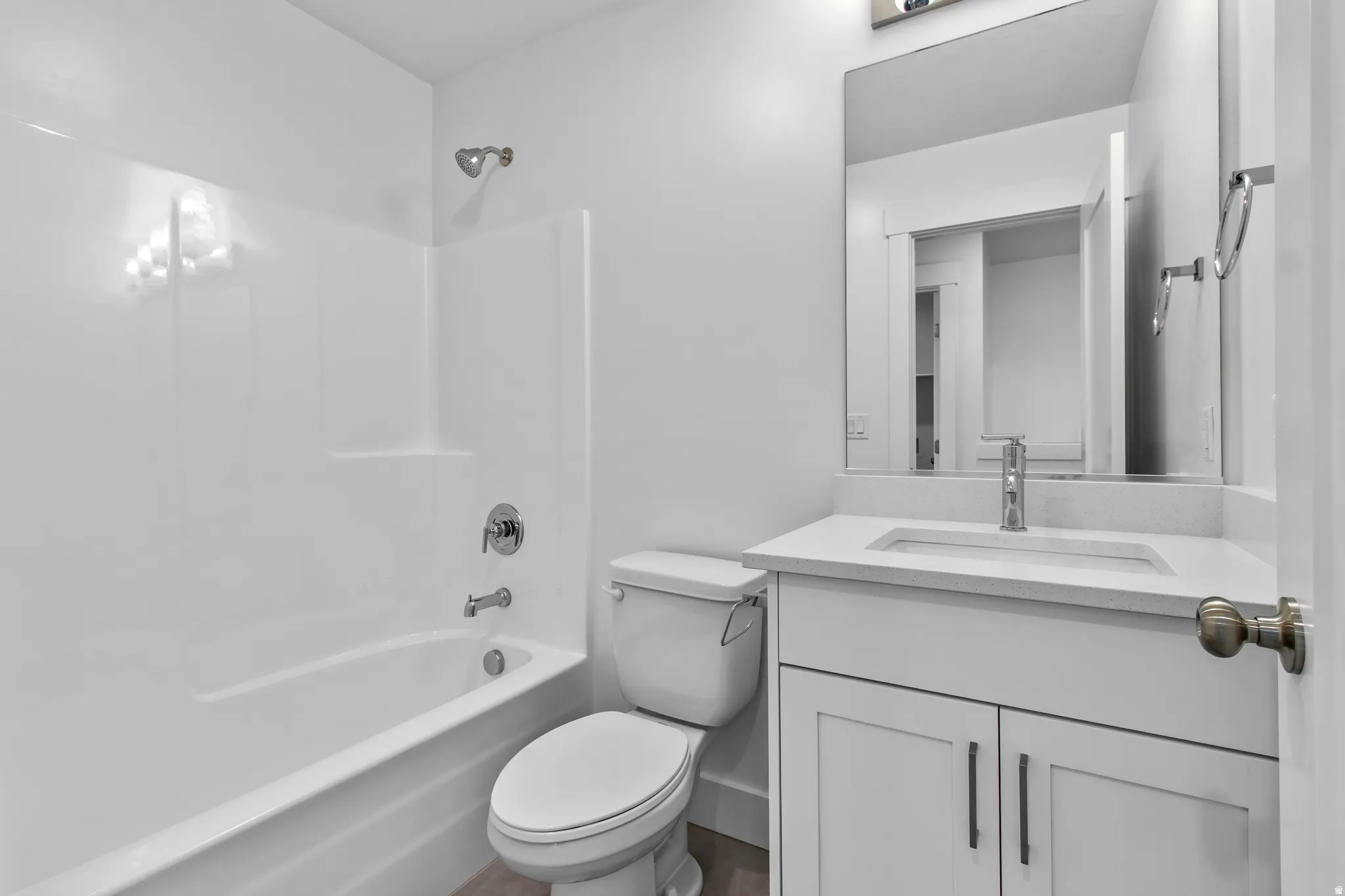 Bathroom featuring vanity and tub / shower combination