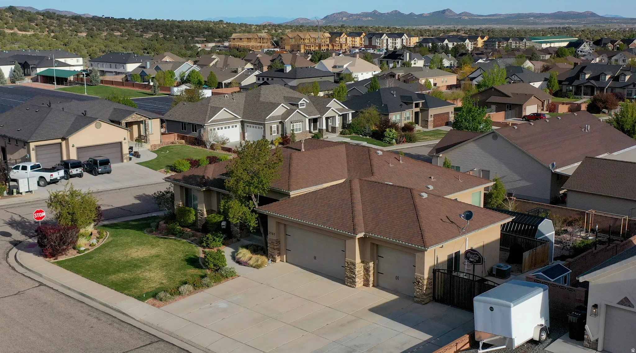 Aerial perspective of suburban area featuring a mountain backdrop