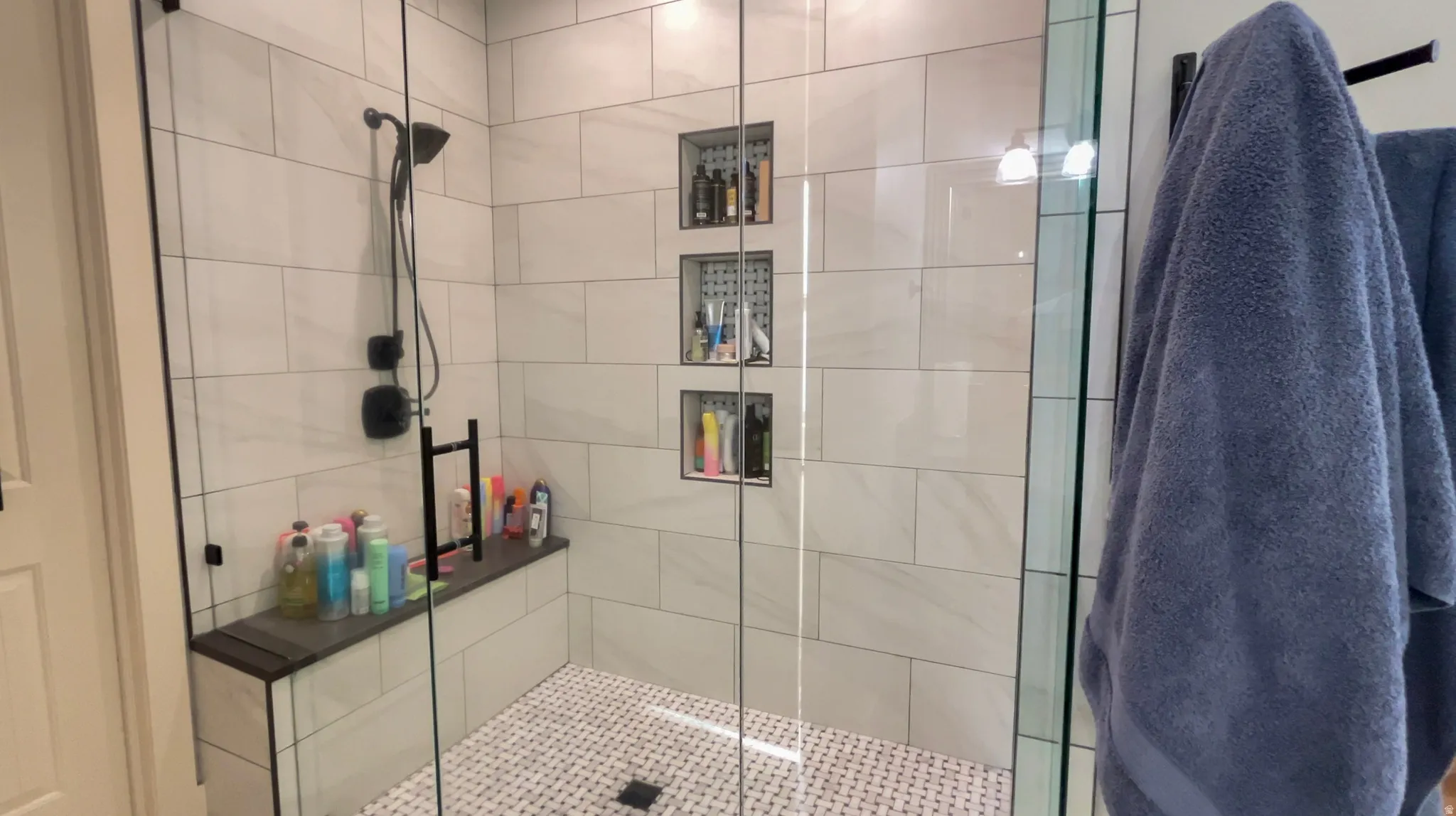 Full bathroom featuring a stall shower
