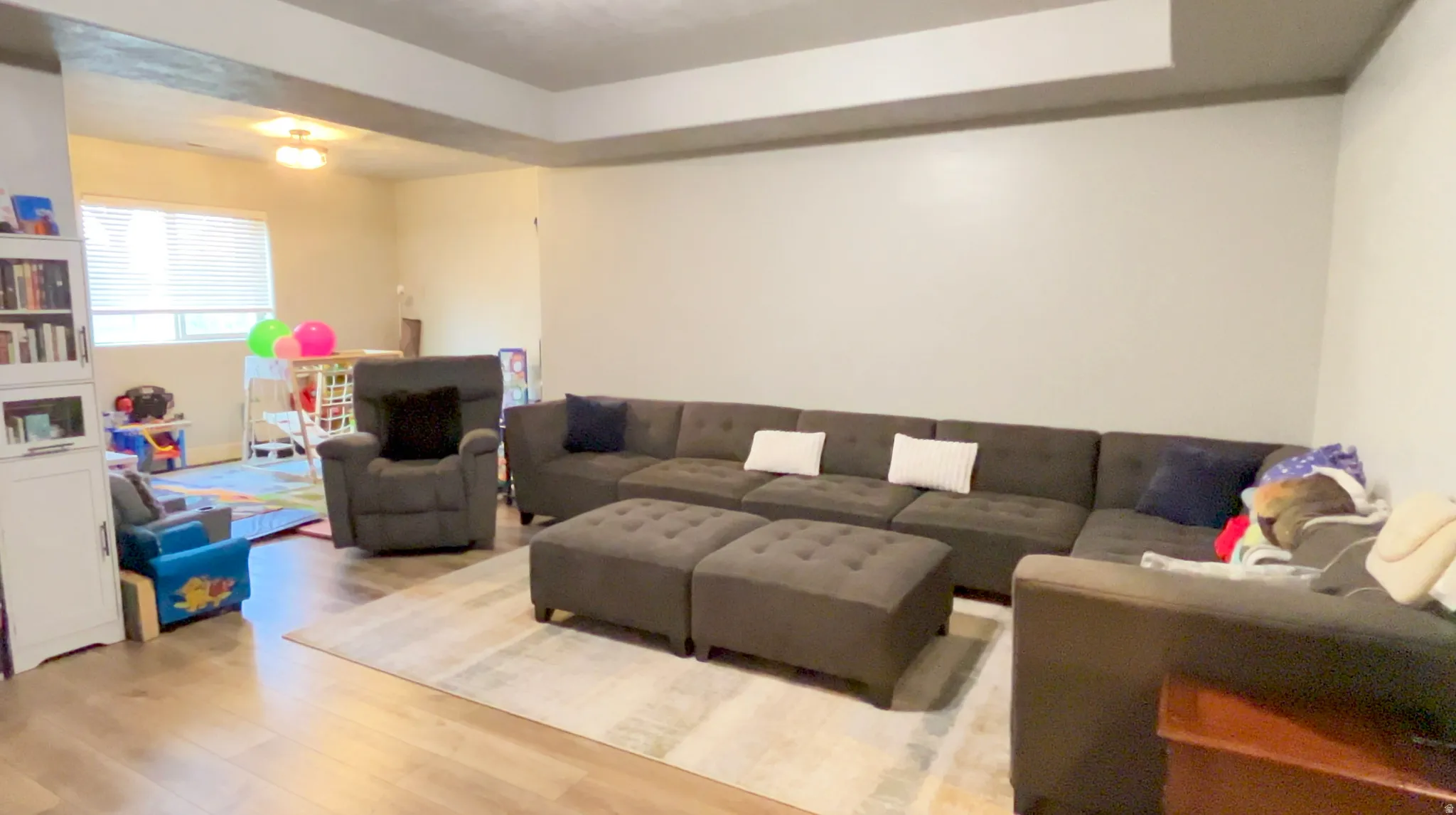 Living room with light wood-type flooring