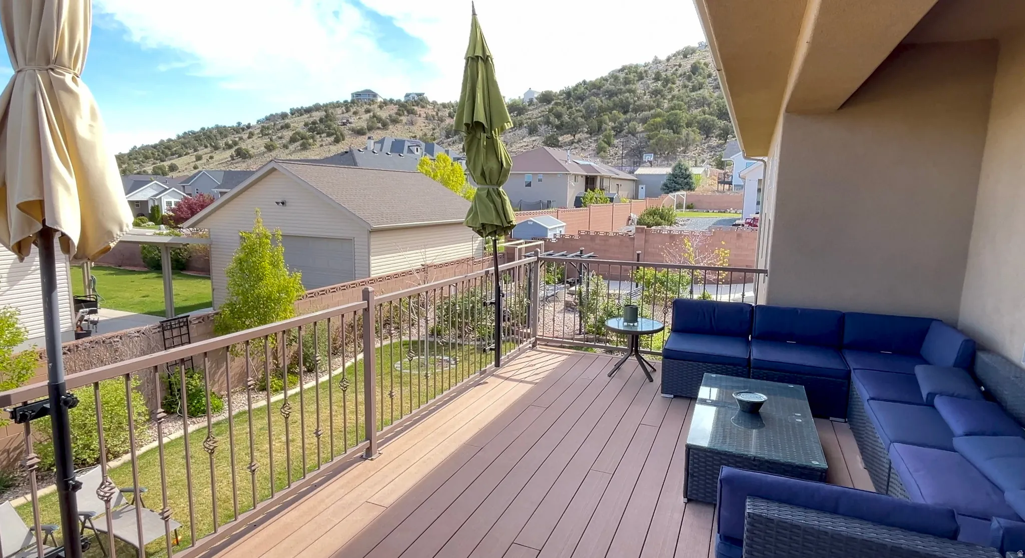 Wooden deck featuring outdoor lounge area and a residential view