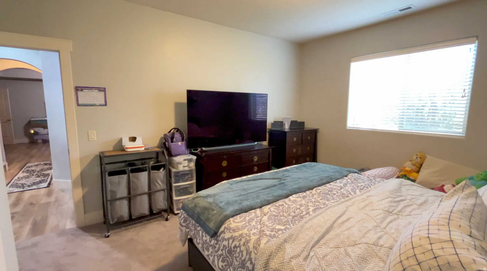 Carpeted bedroom with baseboards