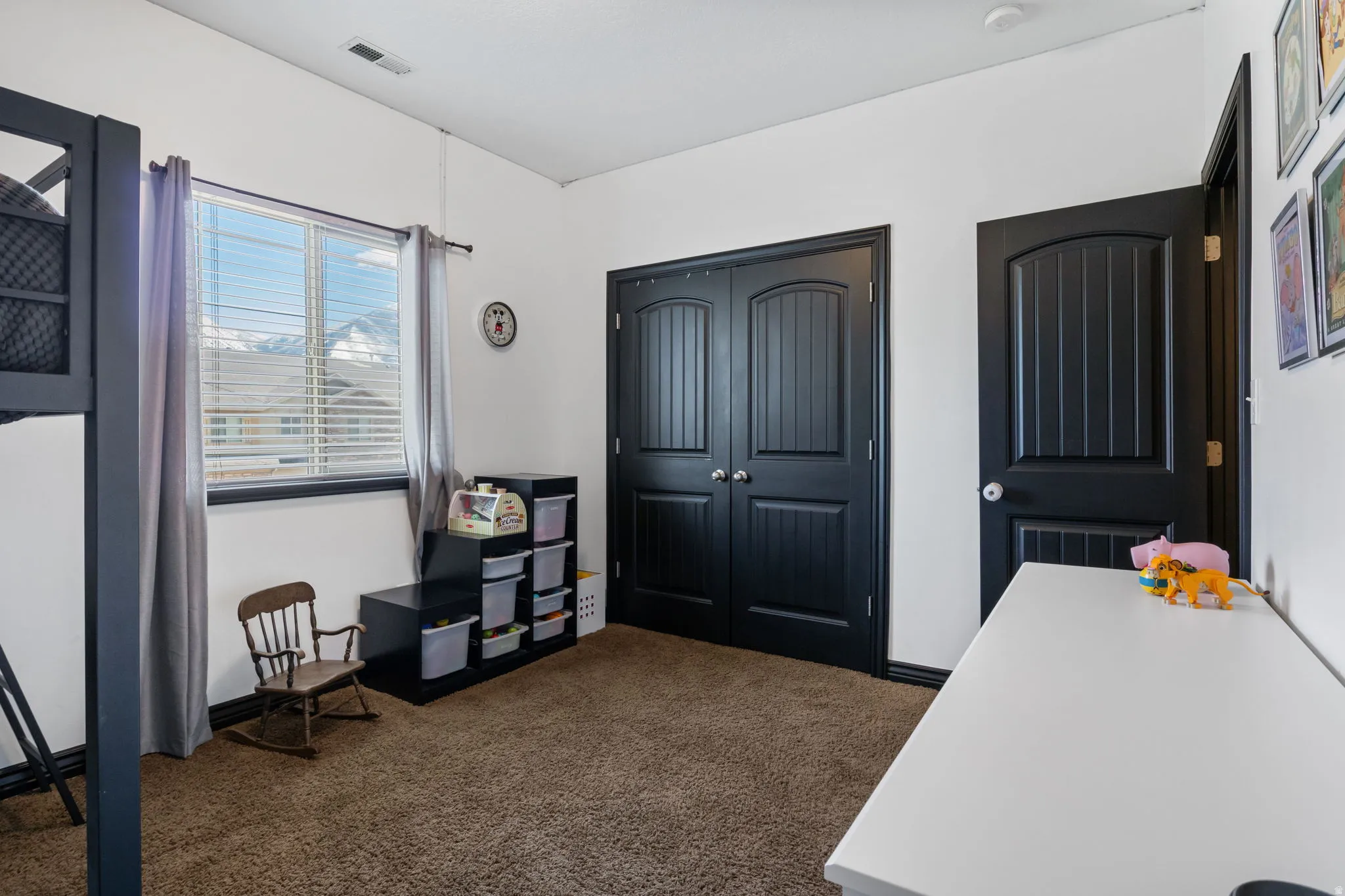 Office area with dark carpet