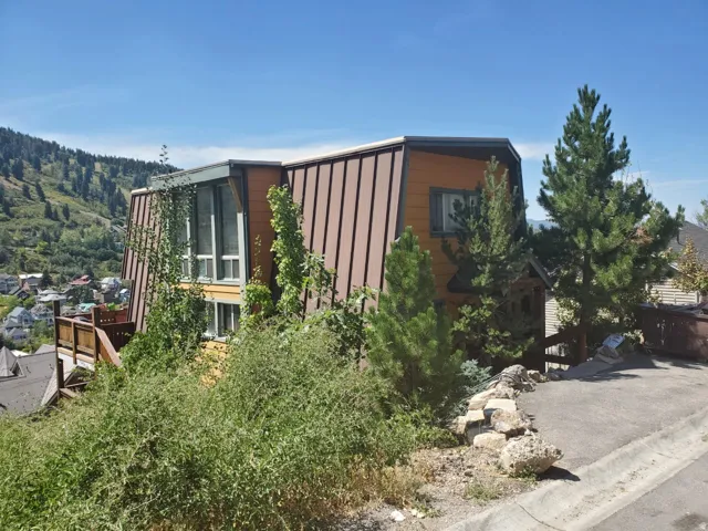 View of side of property with a deck