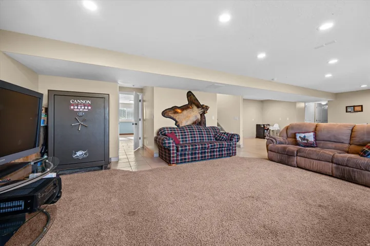 Living room with light carpet and recessed lighting