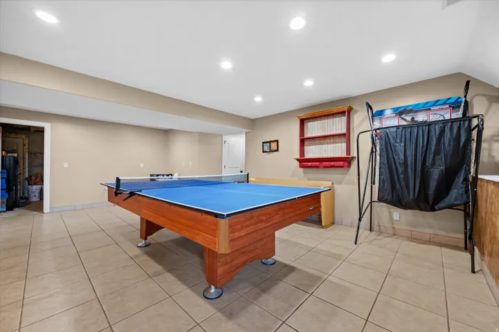 Rec room with light tile patterned floors and recessed lighting