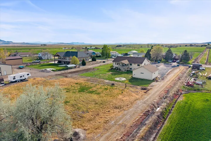 Aerial view of sparsely populated area with nearby suburban area