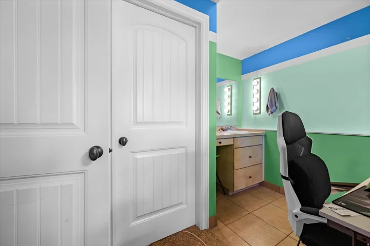 Office area featuring light tile patterned floors