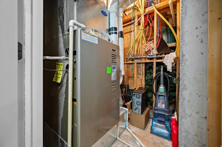 Utility room featuring heating unit