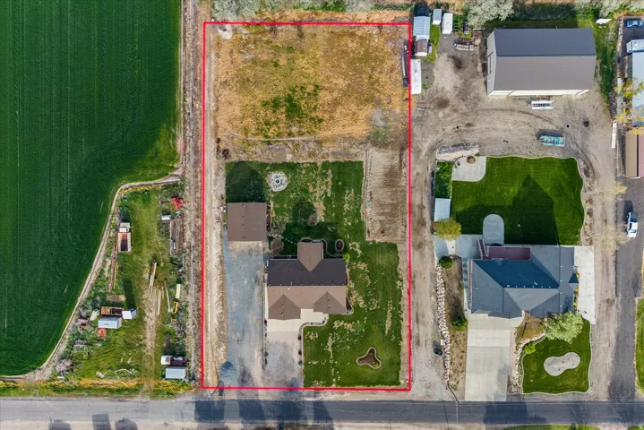Aerial view of property and surrounding area with property boundaries highlighted