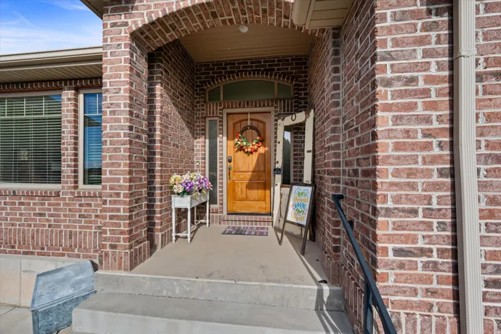 Entrance to property with brick siding