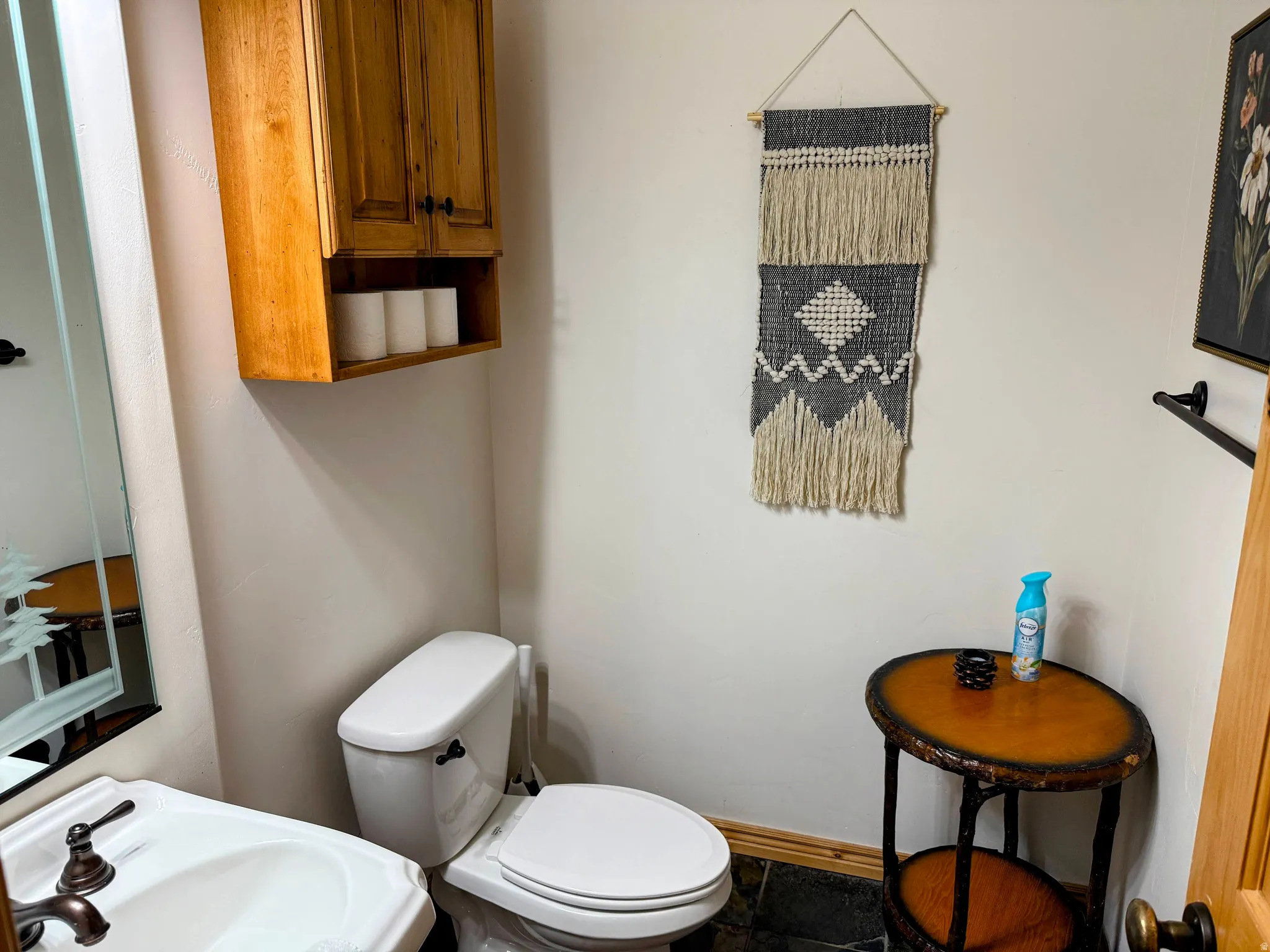 Bathroom with toilet and baseboards