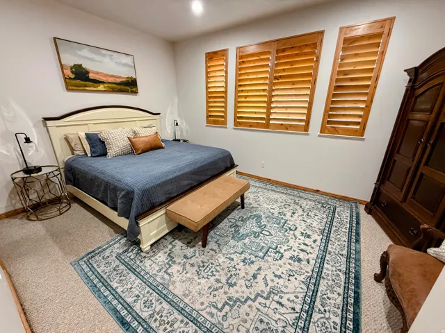Carpeted bedroom with baseboards