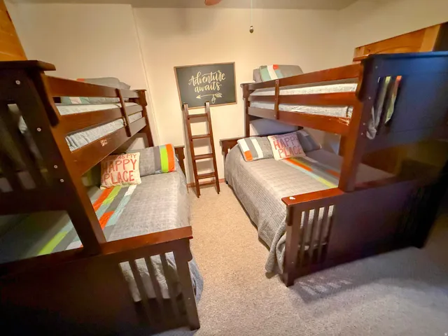 Bedroom with light colored carpet