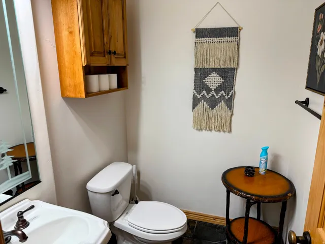 Bathroom with toilet and baseboards