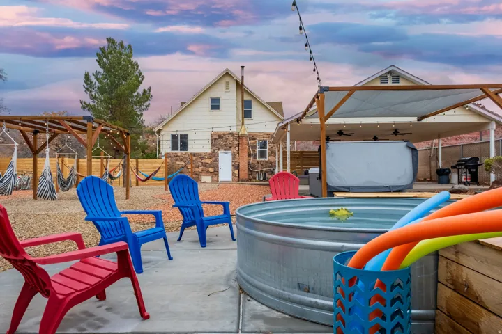 Our communal outdoor space includes: Views, fire pit, seating, cowboy pool, hammocks, hammock chairs, covered patio, BBQ, string lights on timers, wifi connectivity, pergolas, shades