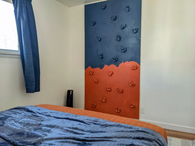 Rock wall in bedroom of unit 6