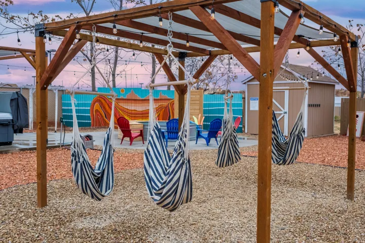 Our communal outdoor space includes: Views, fire pit, seating, cowboy pool, hammocks, hammock chairs, covered patio, BBQ, string lights on timers, wifi connectivity, pergolas, shades