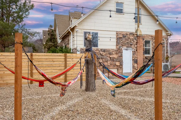 Our communal outdoor space includes: Views, fire pit, seating, cowboy pool, hammocks, hammock chairs, covered patio, BBQ, string lights on timers, wifi connectivity, pergolas, shades