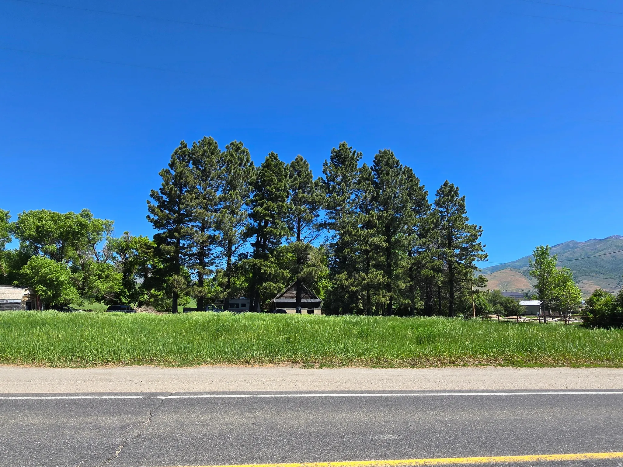 View of asphalt street with a mountain view