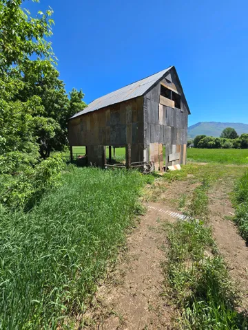 View of outbuilding with a rural view and a mountain view