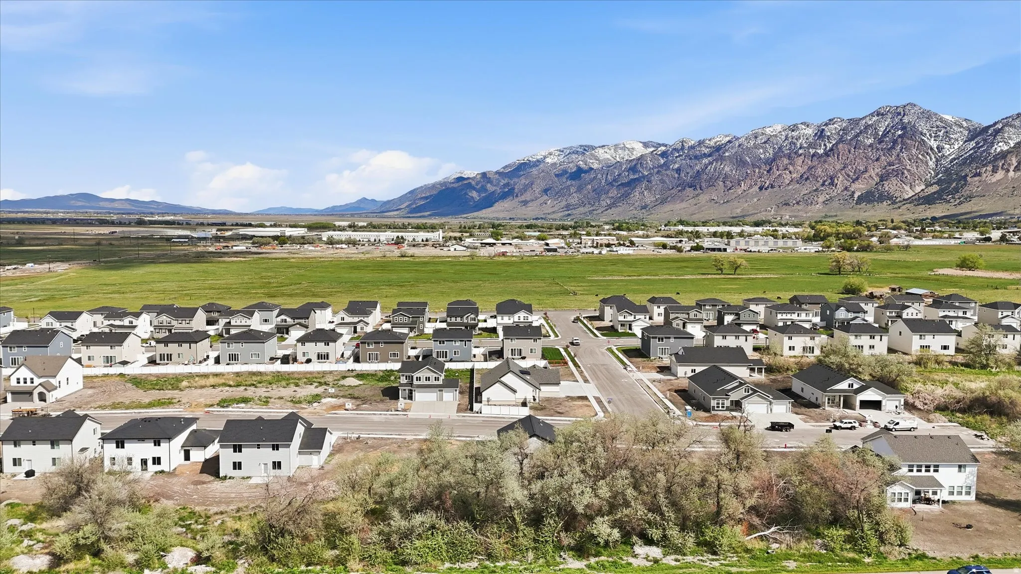 Aerial perspective of suburban area with a mountain backdrop