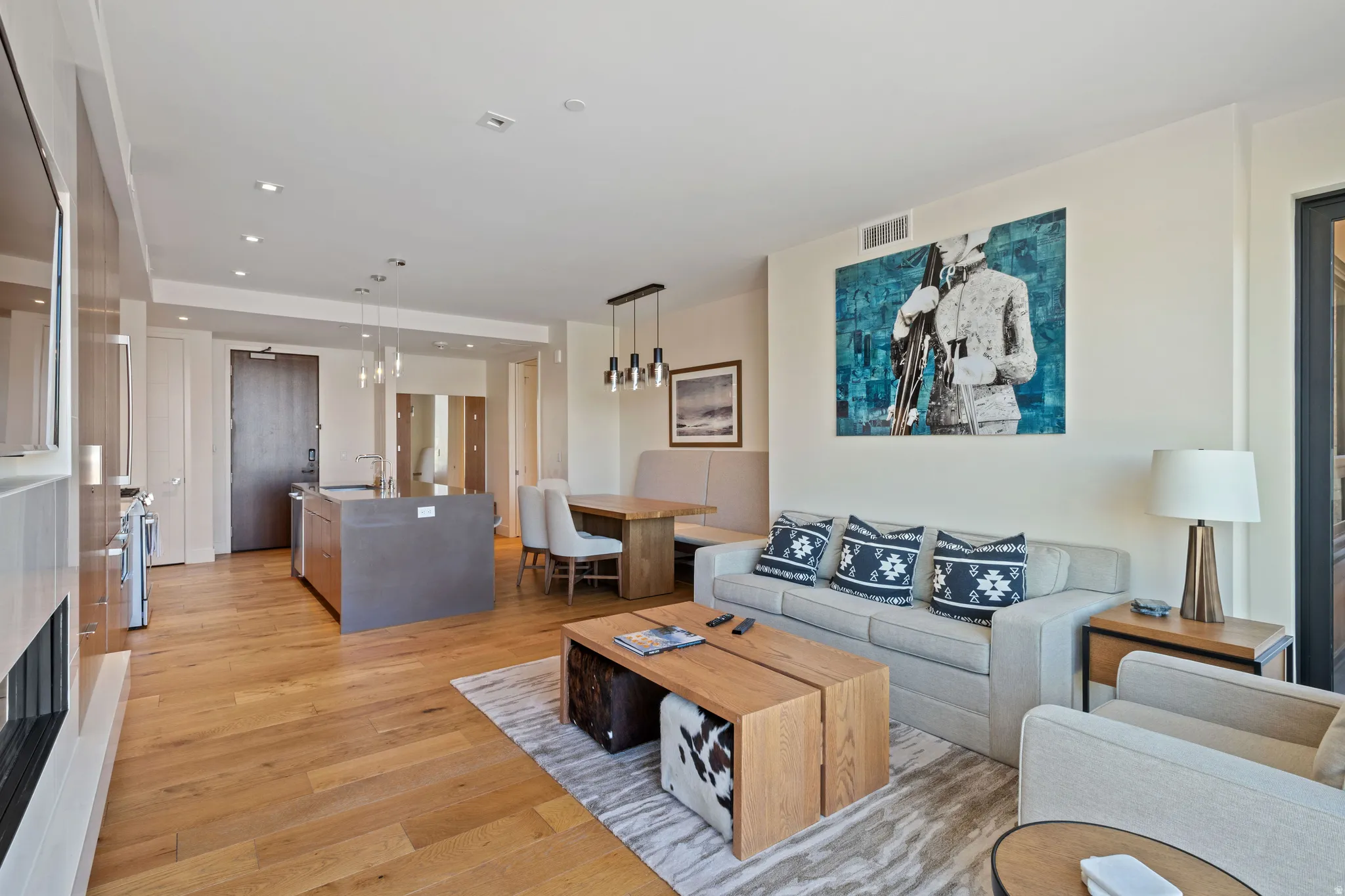 Living room featuring light wood-style floors and recessed lighting