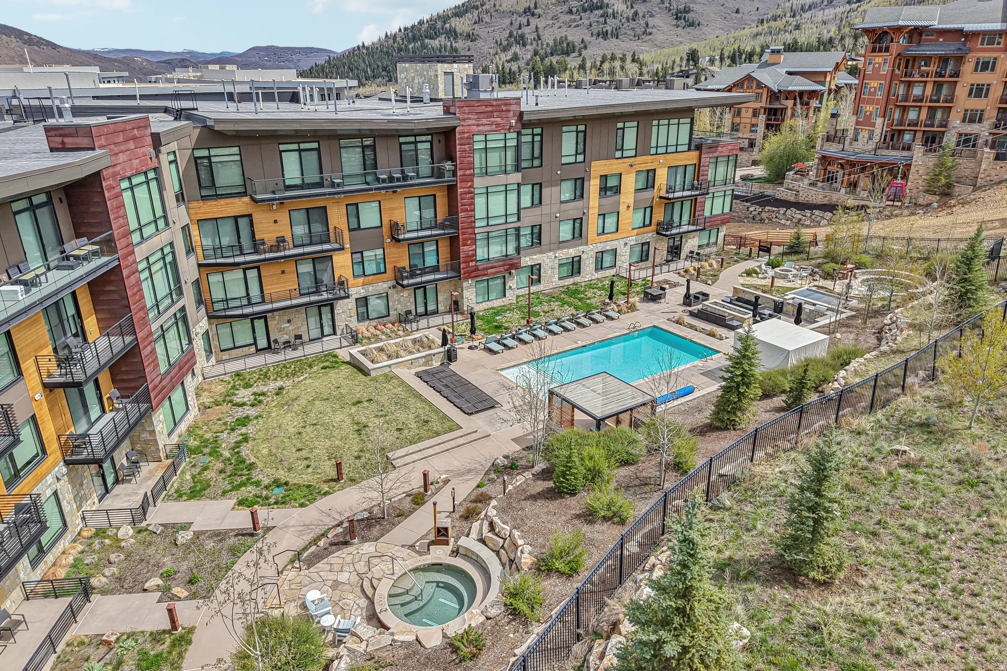 Community pool featuring a mountain view and a patio