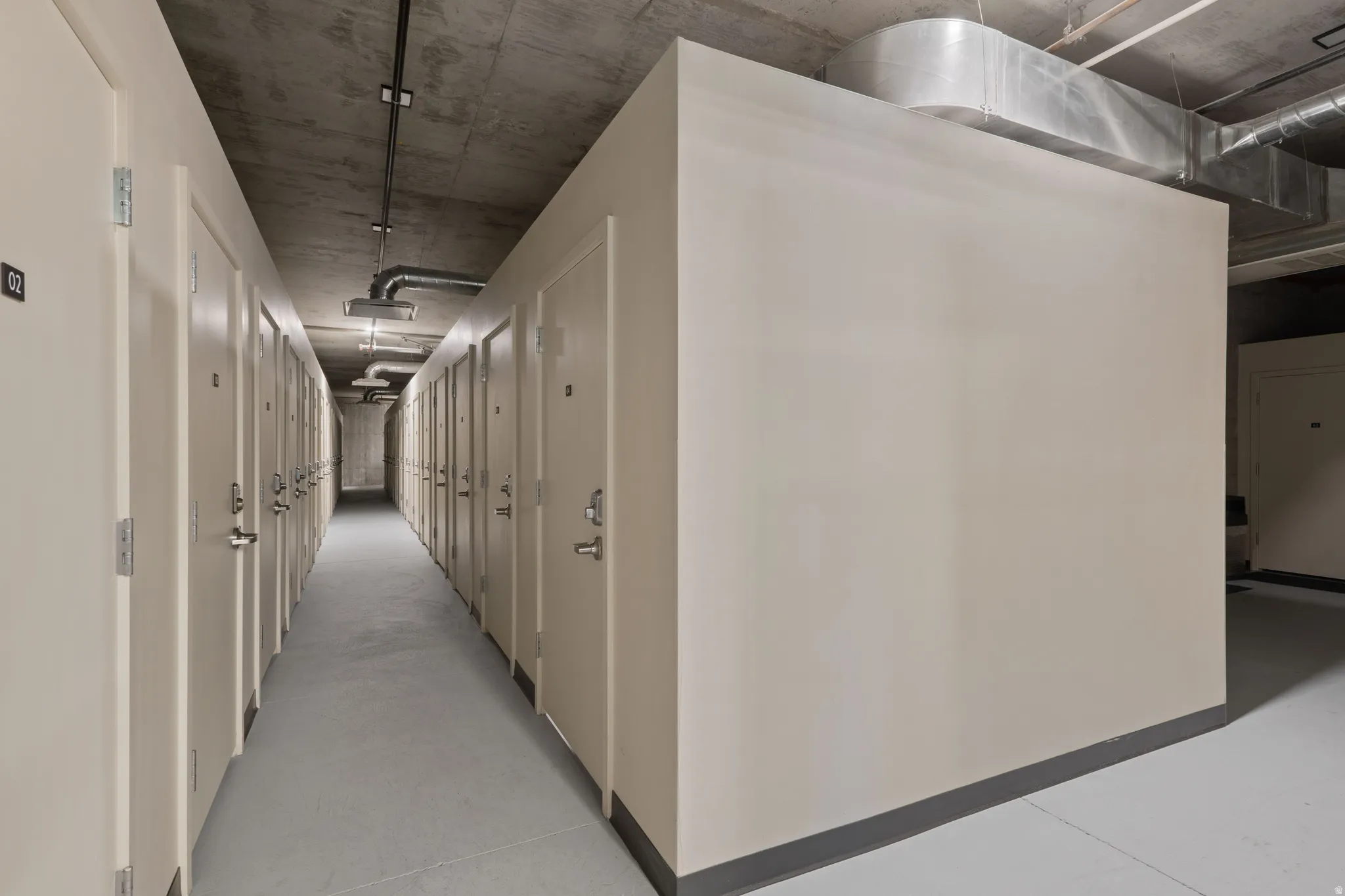 Hall featuring concrete floors