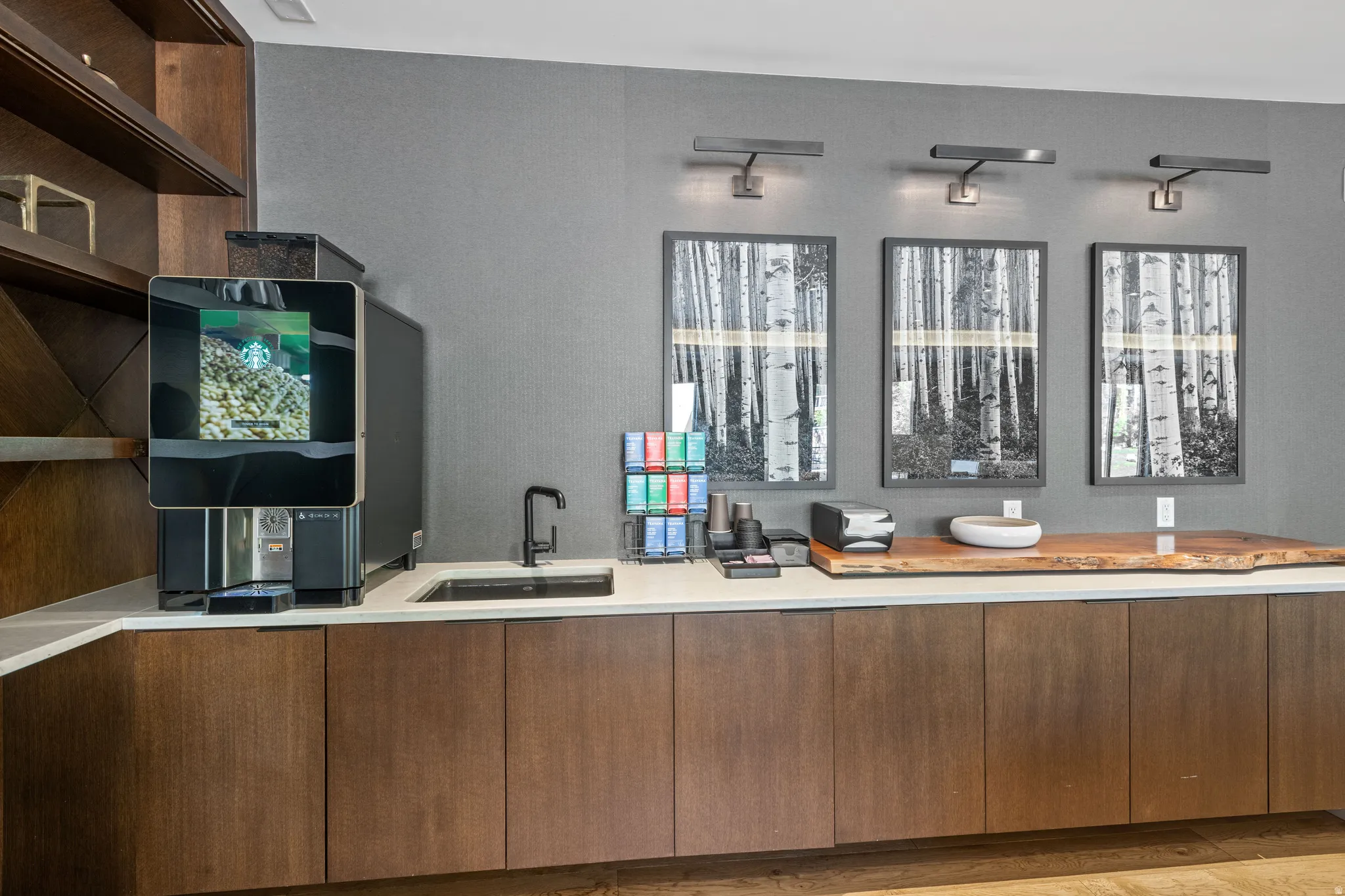 Bar featuring modern cabinets, open shelves, and light stone counters