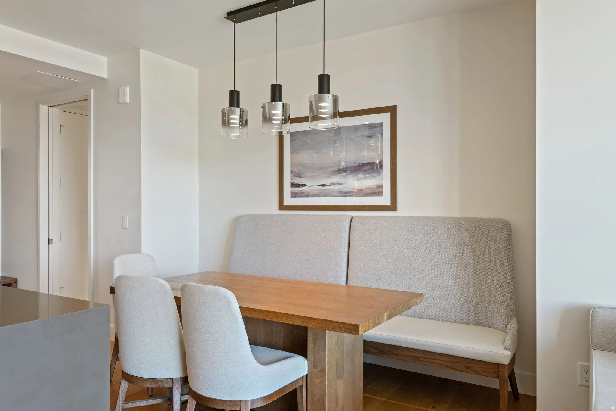 Dining area with wood finished floors and breakfast area