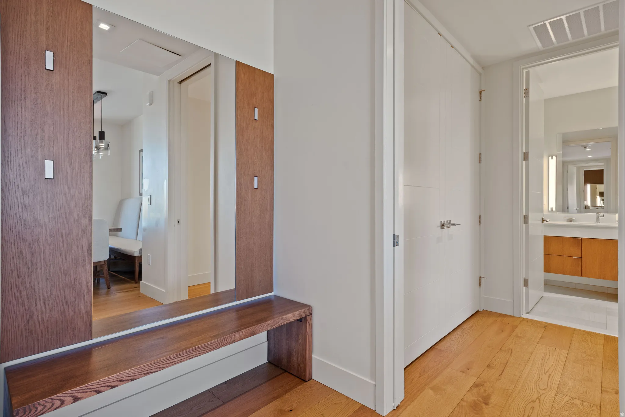 Hallway featuring light wood-style floors and baseboards
