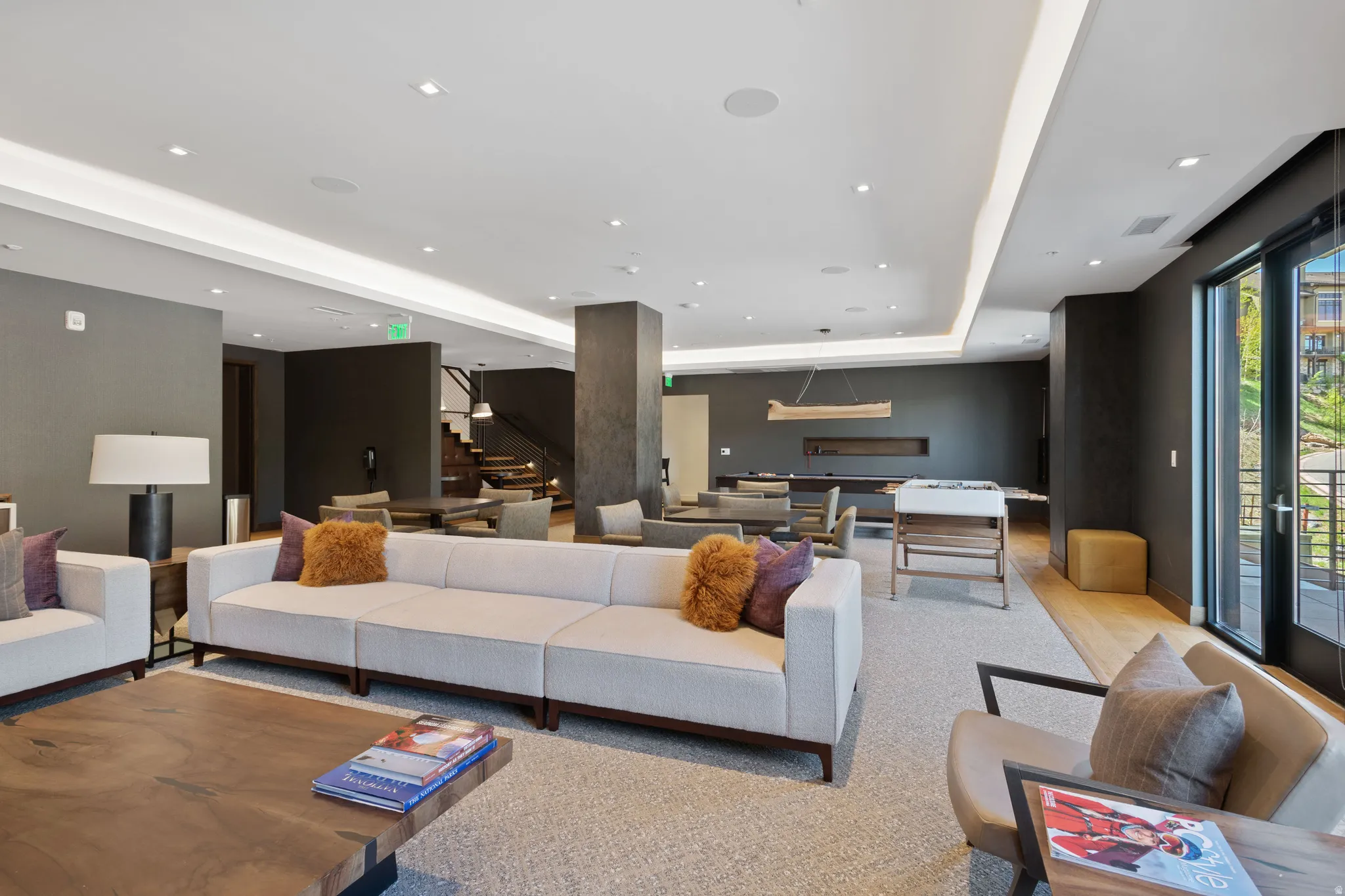 Community lobby with recessed lighting and a tray ceiling