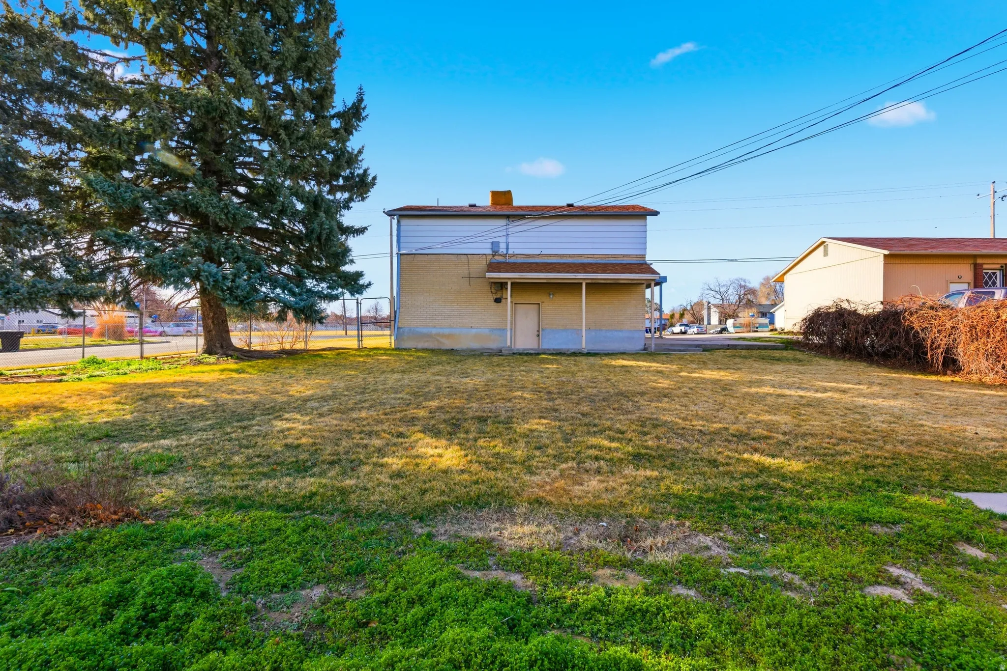 Back of house with a chimney