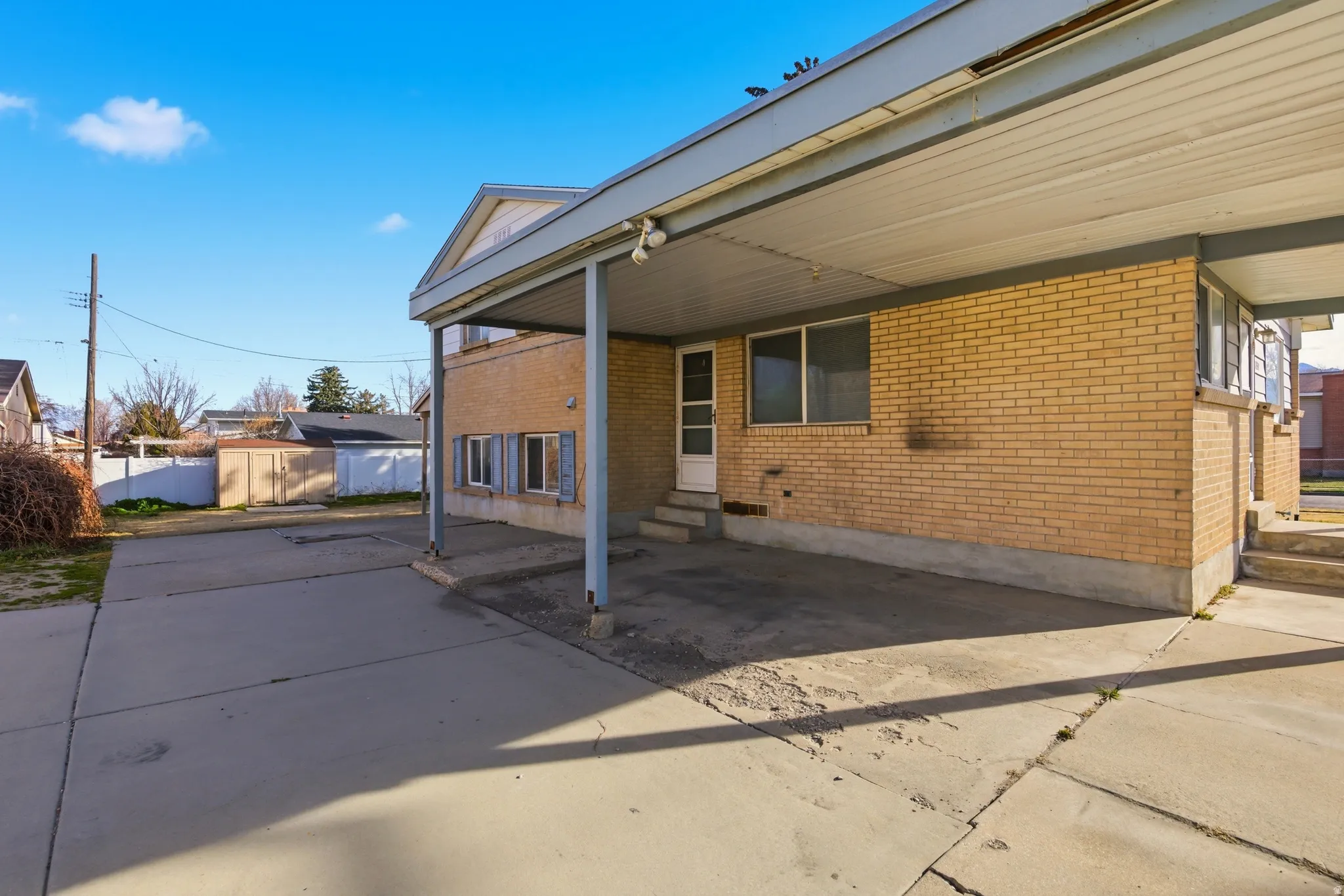 View of patio featuring entry steps and an outdoor structure