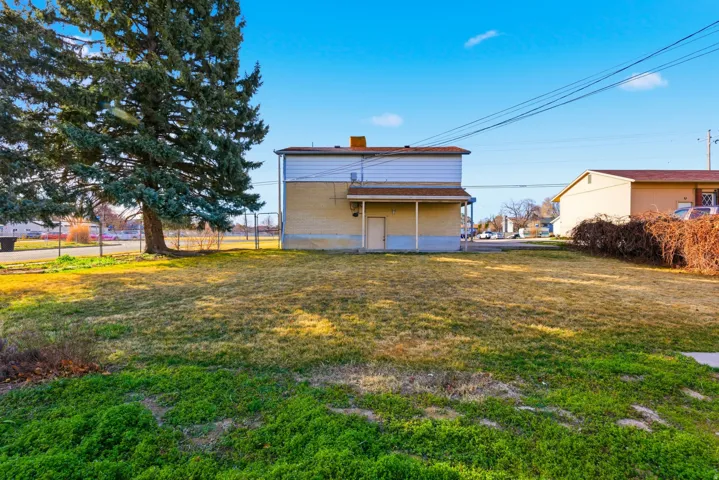 Back of house with a chimney