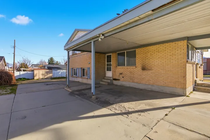 View of patio featuring entry steps and an outdoor structure