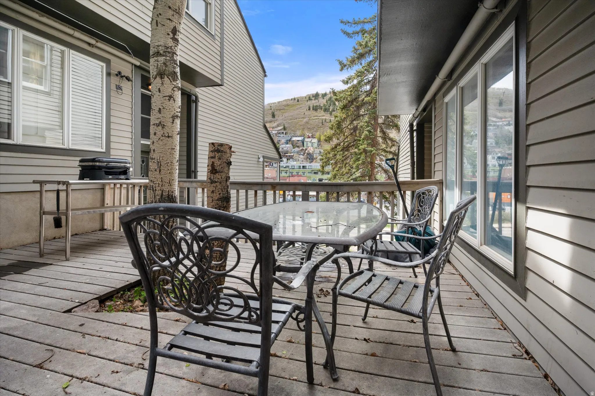 Wooden deck with outdoor dining.