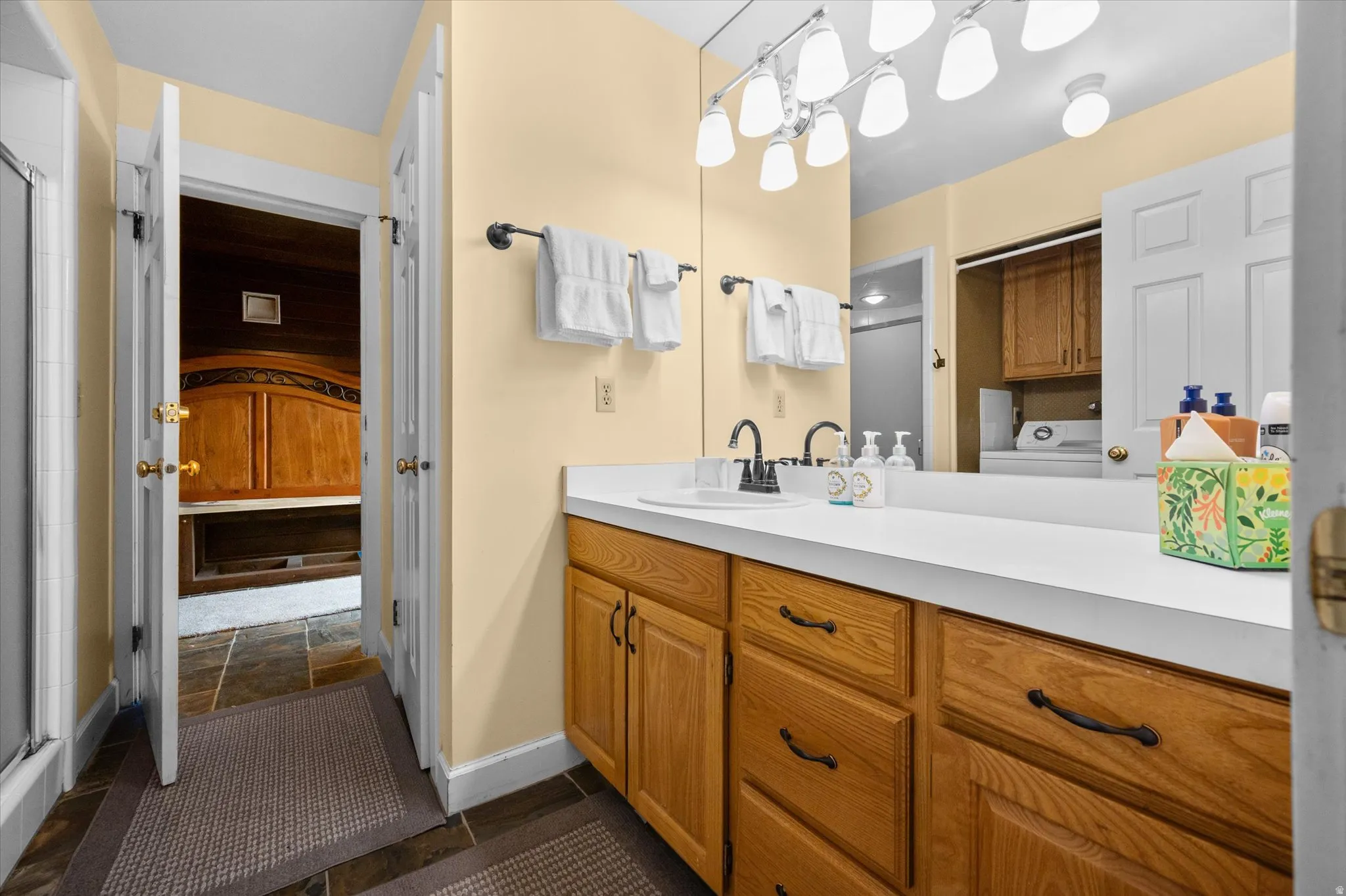 Fourth floor 3/4 bath with en suite water closet, shower, and double vanity.