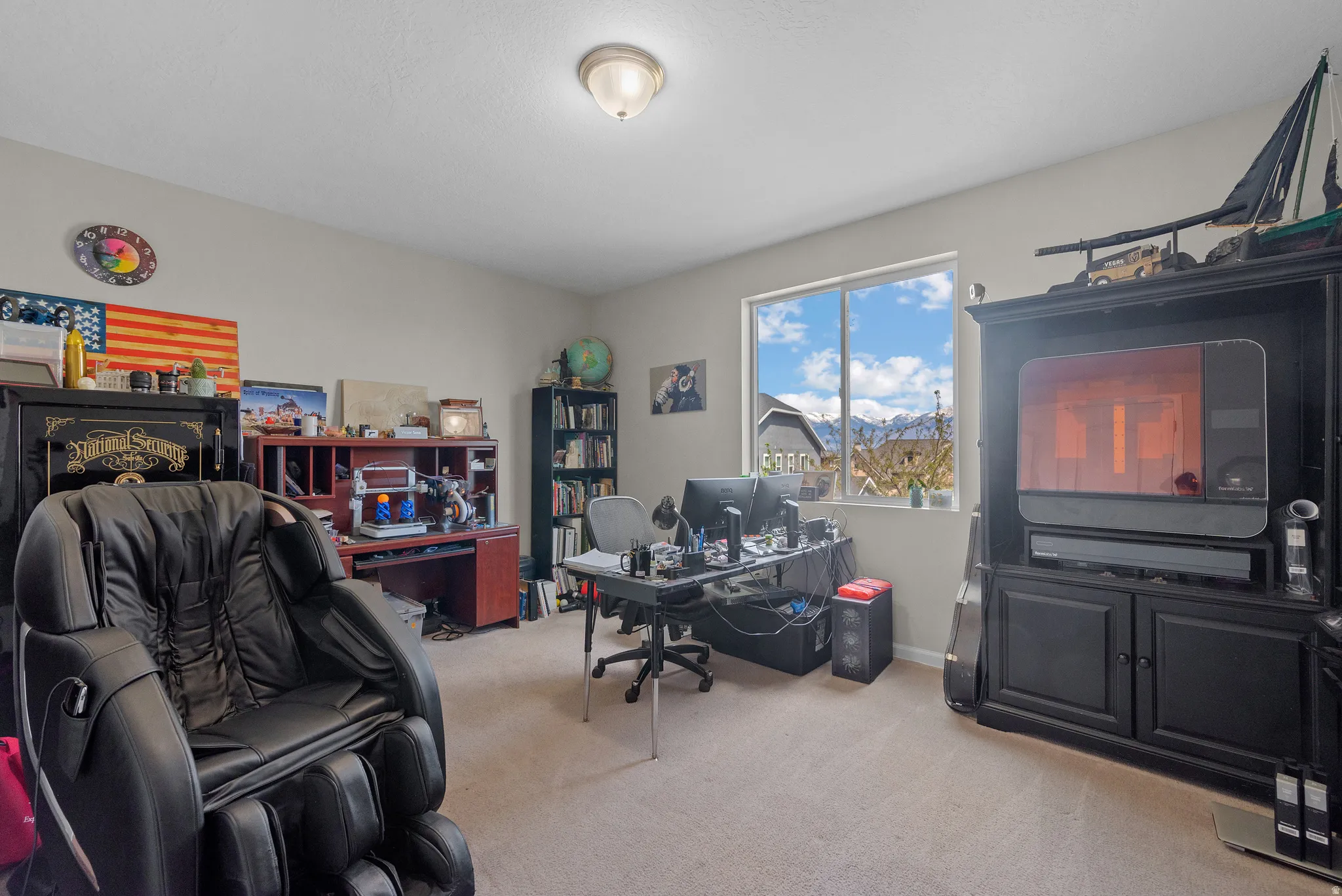 Home office featuring light carpet and baseboards