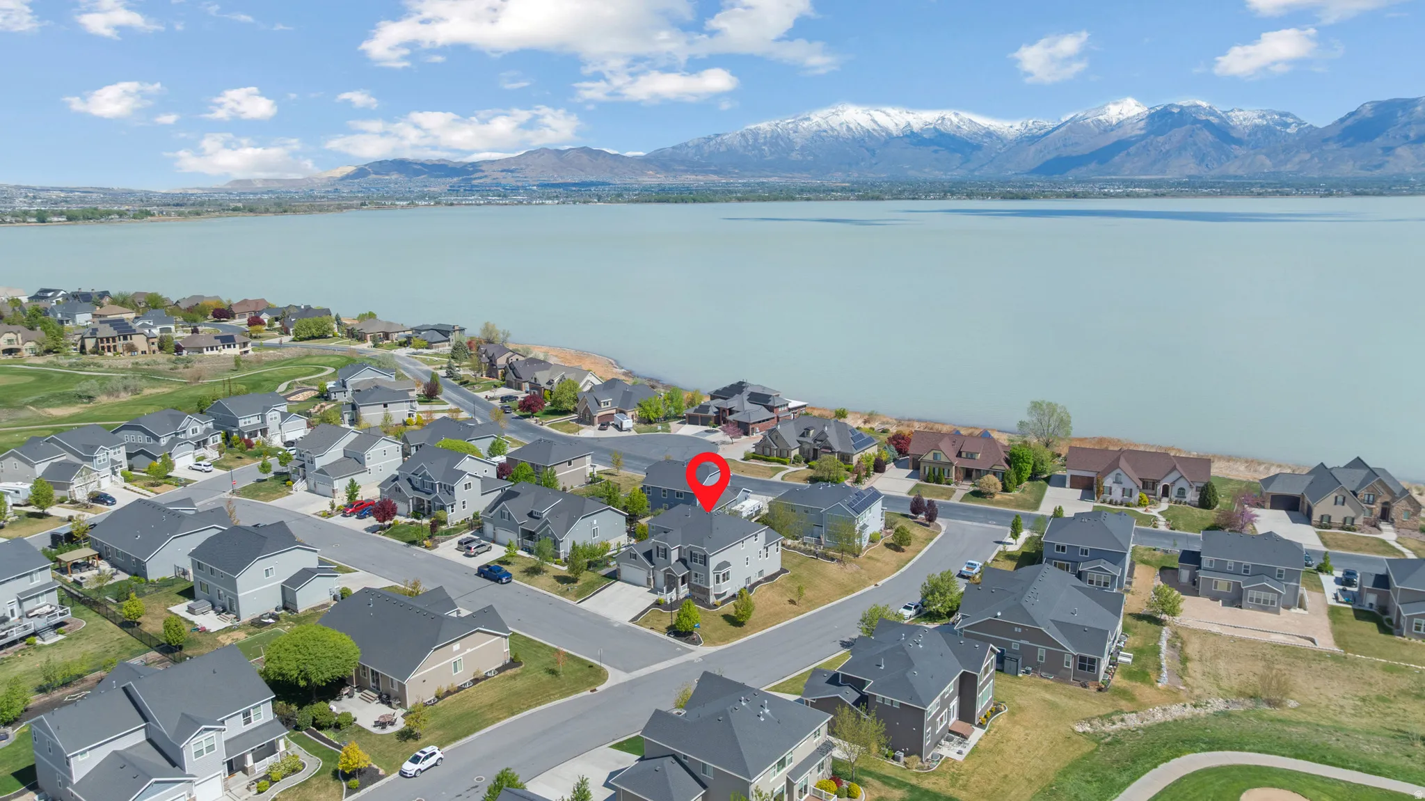 Aerial perspective of neighborhood with a water and mountain view