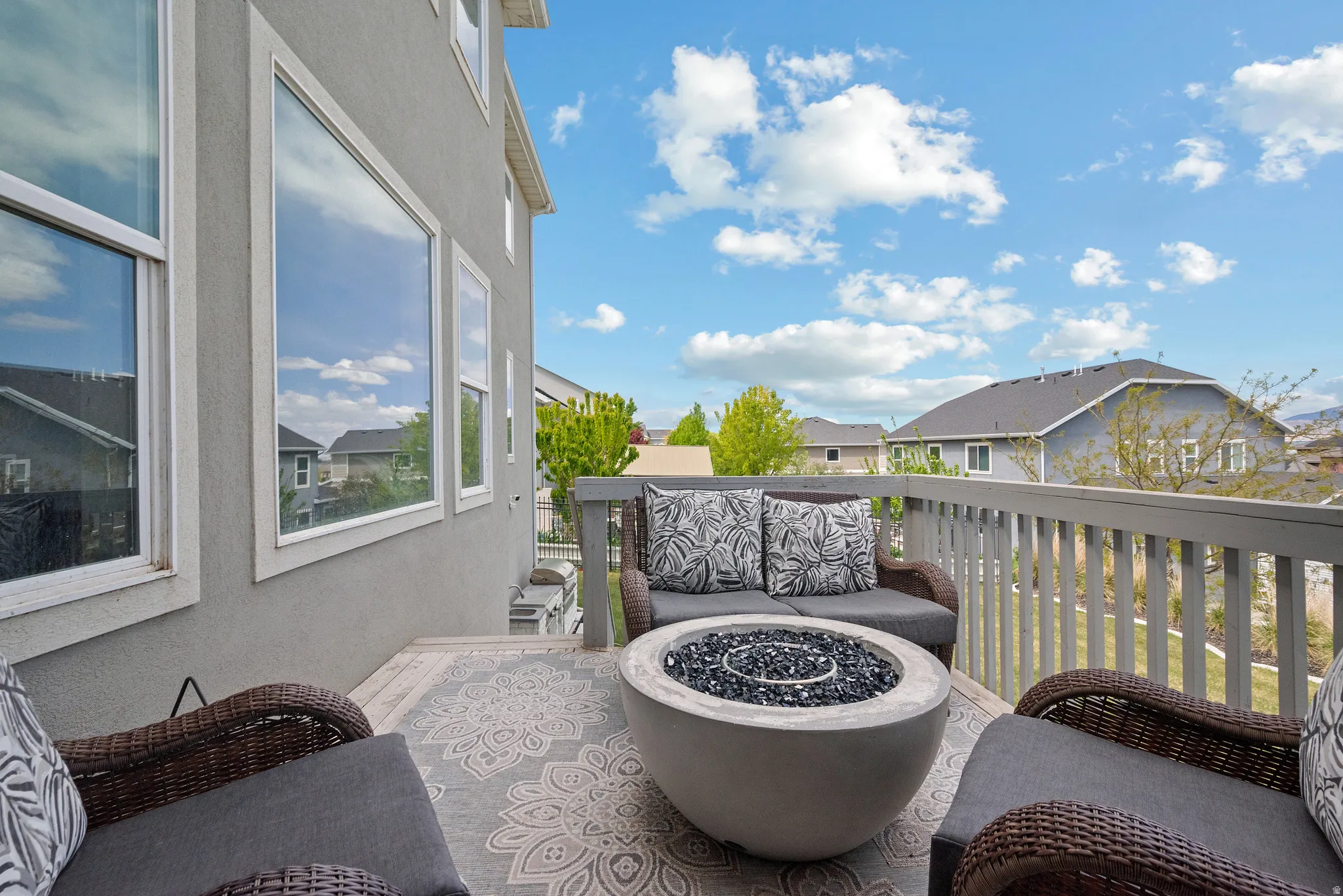 Deck featuring an outdoor living space with a fire pit and  view
